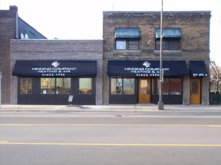 The Hinding Heating shop on West 7th Street, St. Paul, with its Since 1936 awnings